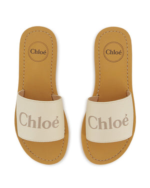 
  
    Chloé
  
 Girls Ivory Canvas Slides