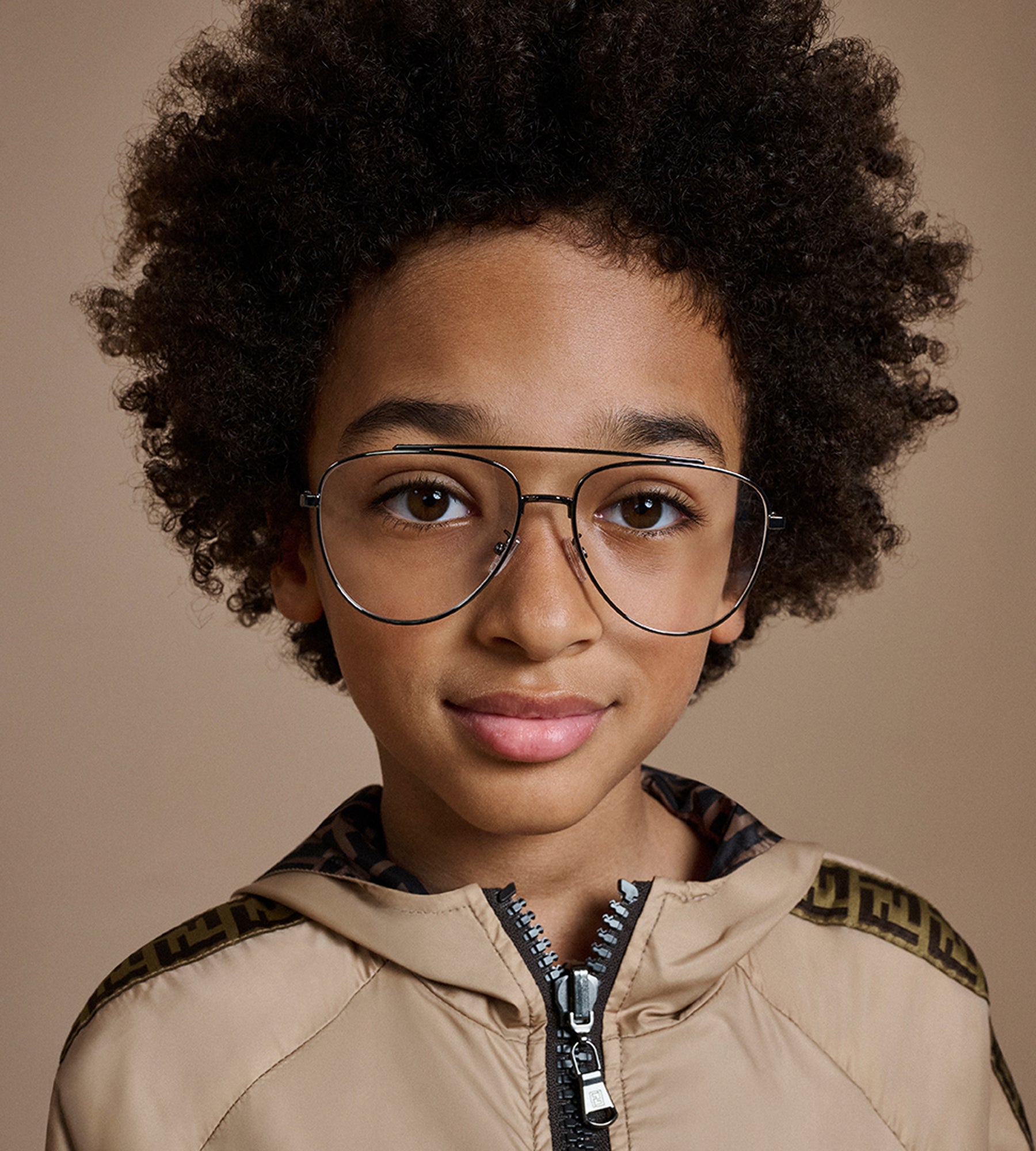 Child in glasses wearing Fendi jacket